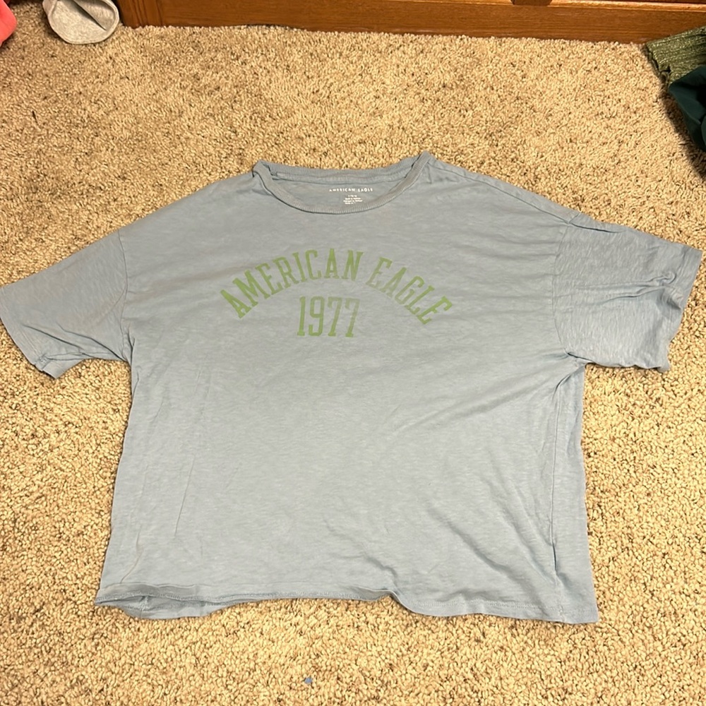 This T-shirt is from American eagle, it’s a size L, and it’s blue